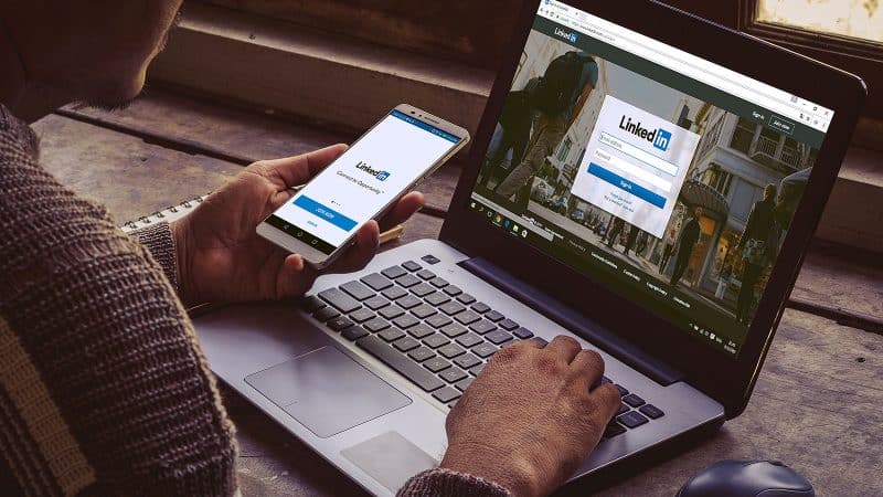 College student celebrates graduation with some LinkedIn screentime