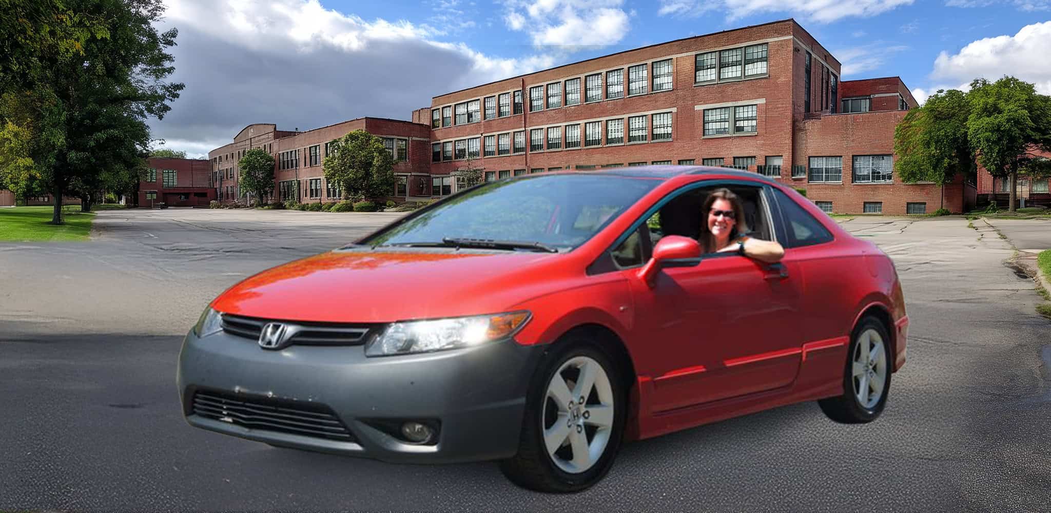 A woman drives a used Honda Civic on campus